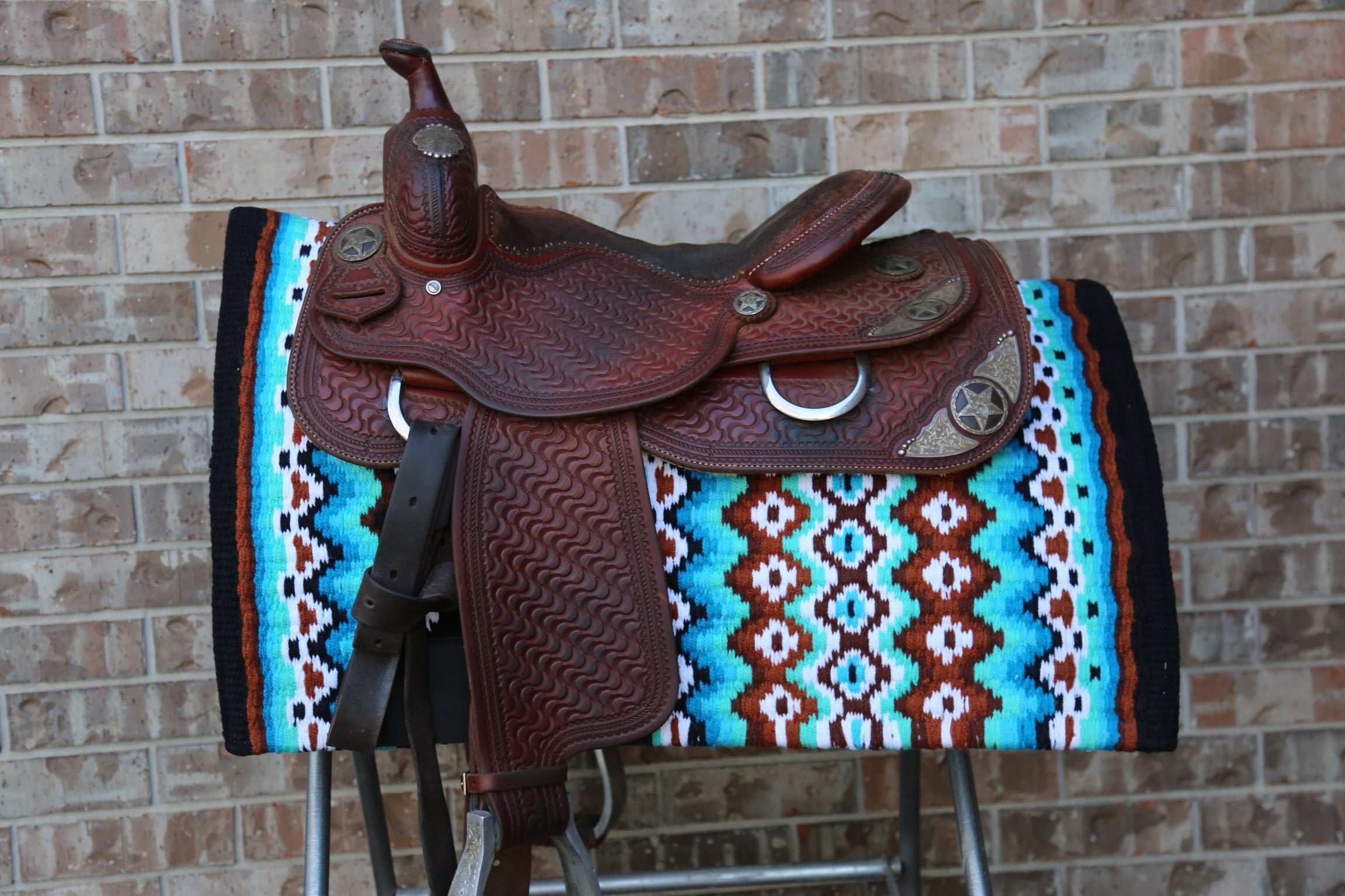 Custom Western Saddle Pad in Blue, Brown, Black and white geometric pattern and western saddle on top