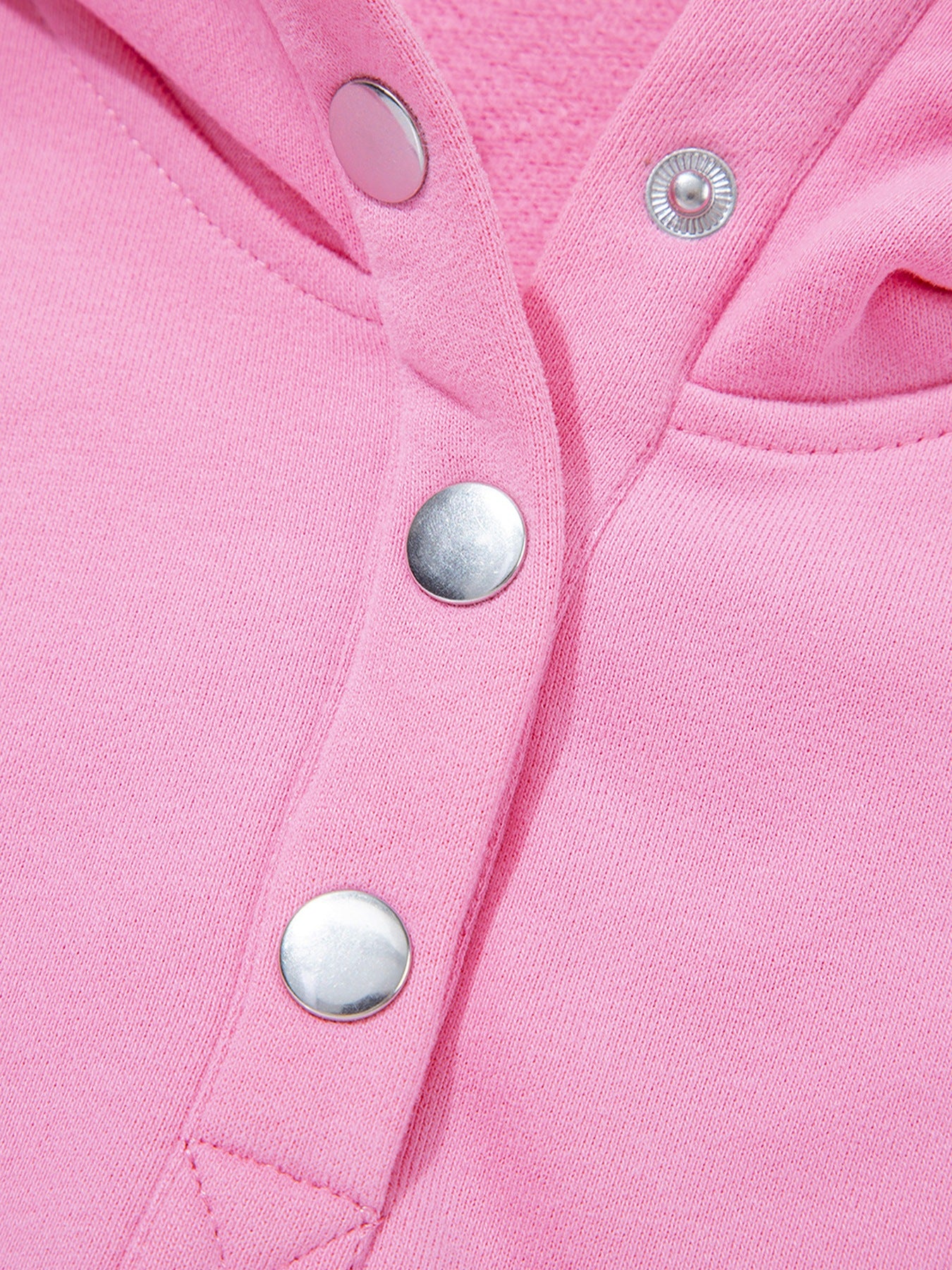 closeup of a pink Eyelet Lace Snap Button Sweatshirt